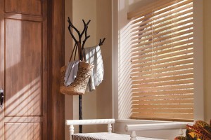 Sun shining through Natural Color faux wood blinds, boot hanging from hat tree