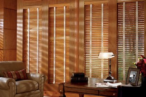 Sun shining through wood blinds in home living room